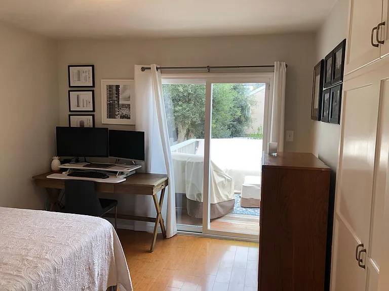 Patio door to deck in 1st bedroom