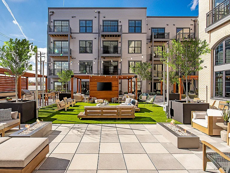 Experience upscale living with this trendy outdoor lounge area, perfect for relaxation and gatherings.