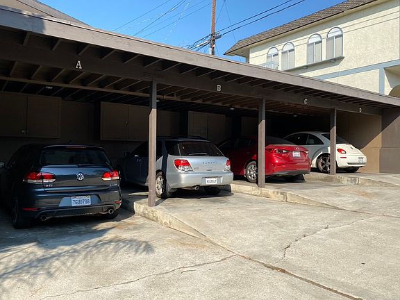 Designated carport with enough room for 2 cars back to back.