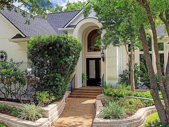 Front of Home with Beautiful Double Entry and Gas Coach Lights