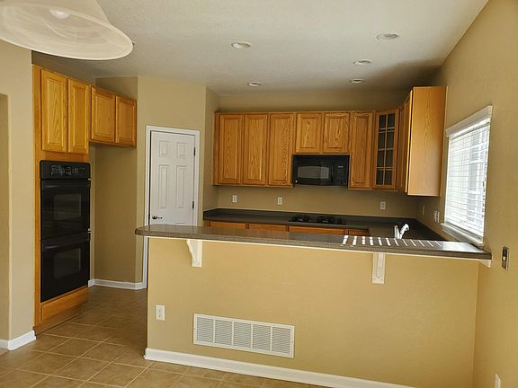 Kitchen with 42-inch cabinets, abundant counter space, and a new refrigerator coming this week
