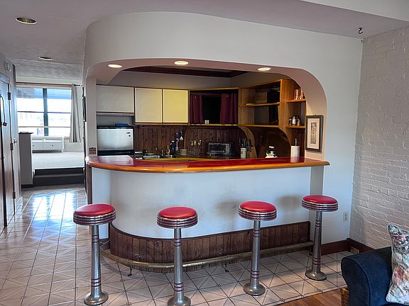 Kitchen, with hallway to bedroom
and harbor views. Walk in Closet is opposite kitchen. Library/Office area to left of kitchen off hallway.