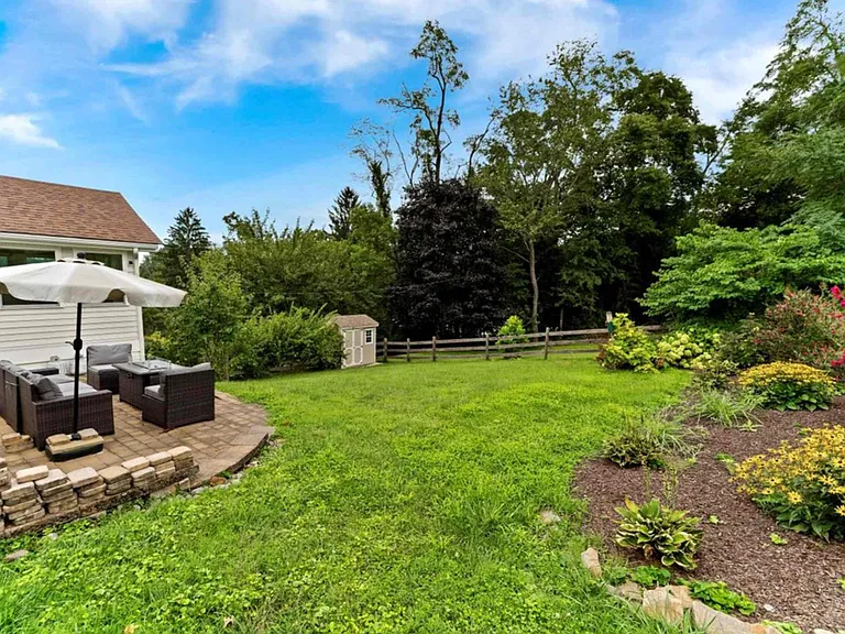 Backyard with patio furniture, grill, and propane fire pit. Perfect for watching all the wildlife!