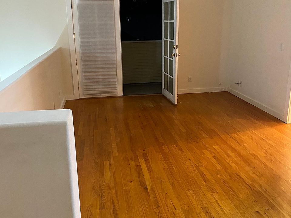 Living room, door opens to small balcony
