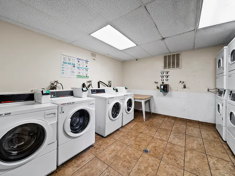 Convenient on-site laundry facility with multiple washers and dryers for resident use.