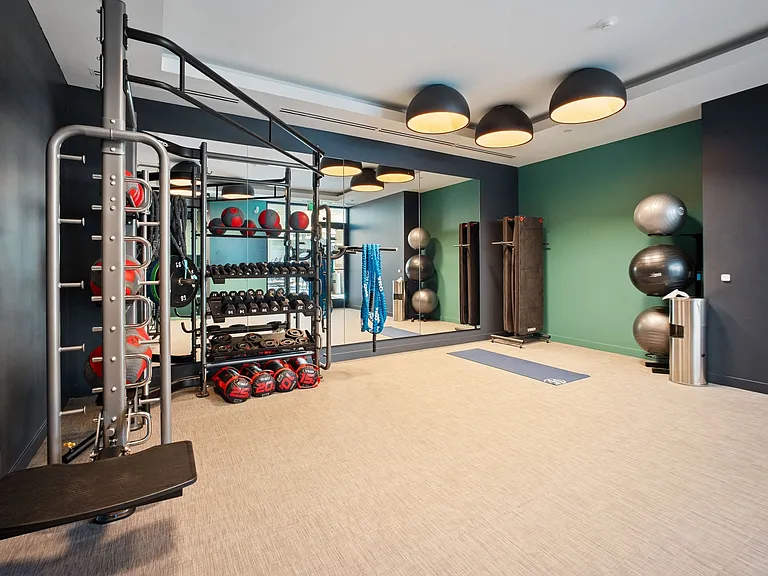 Stretch and strengthen in the open fitness room, complete with weights, bands, and a tranquil space for yoga