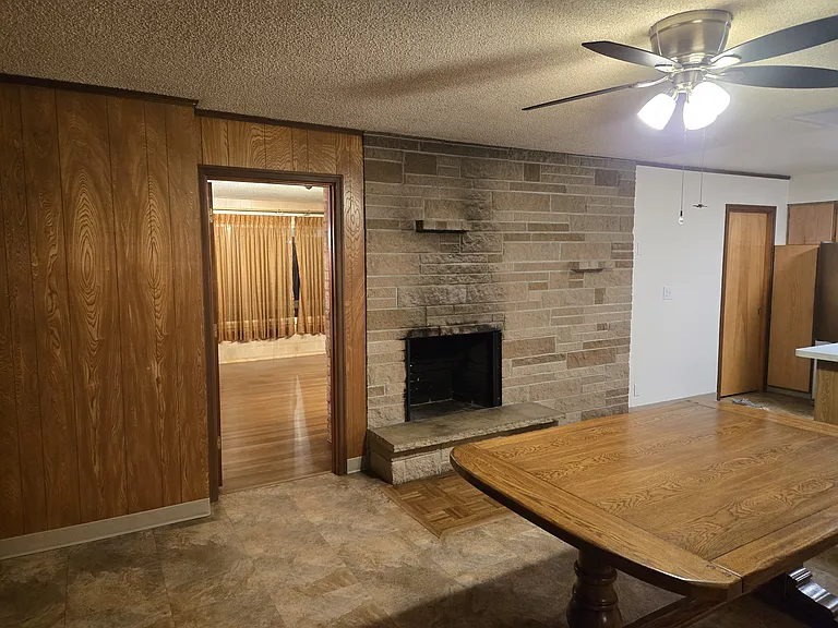 Dining Room with access door to livin room and another decorative fireplace