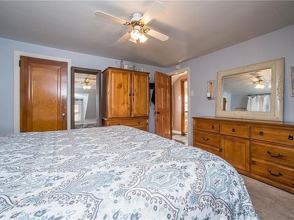 The master bedroom, measuring a spacious 14x13, is found on the upper level. It is outfitted with new wall-to-wall carpeting, a 