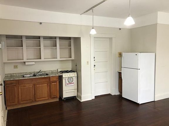 Galley kitchen that is part of the living room.