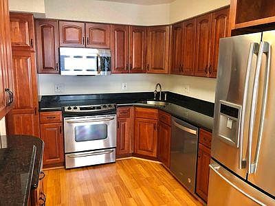 Kitchen features granite counters and stainless steel appliances