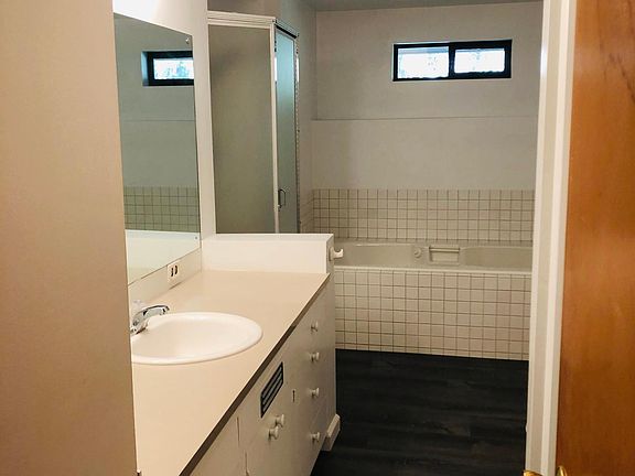 Large Main Bathroom. Storage. Shower. Tub. New flooring