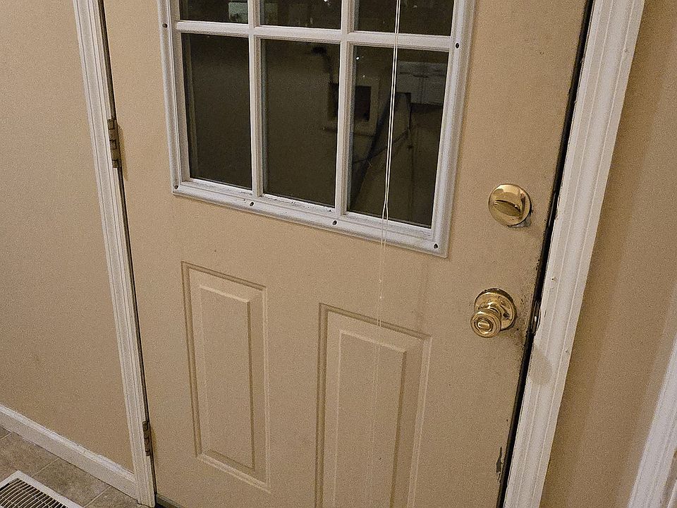 Carport entrance door opens to laundry room and kitchen.