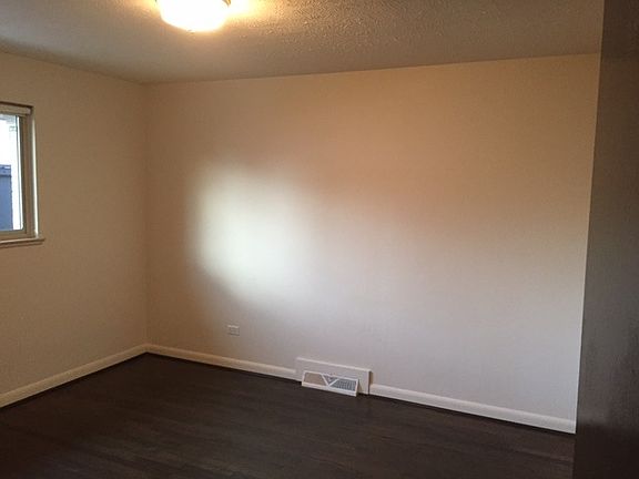clean white walls and hardwood floor throughout