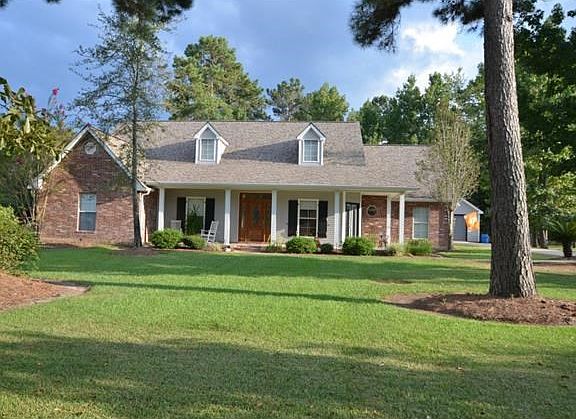 Beautiful Acadian-style home with wrap-around porch