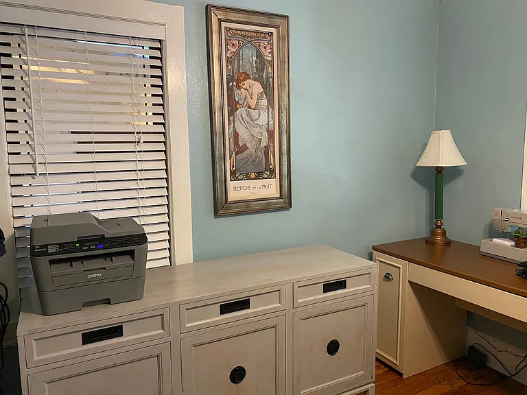 Work desk, dresser and printer in second bedroom