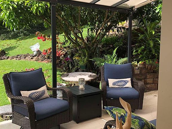 Covered outdoor seating area with fire pit