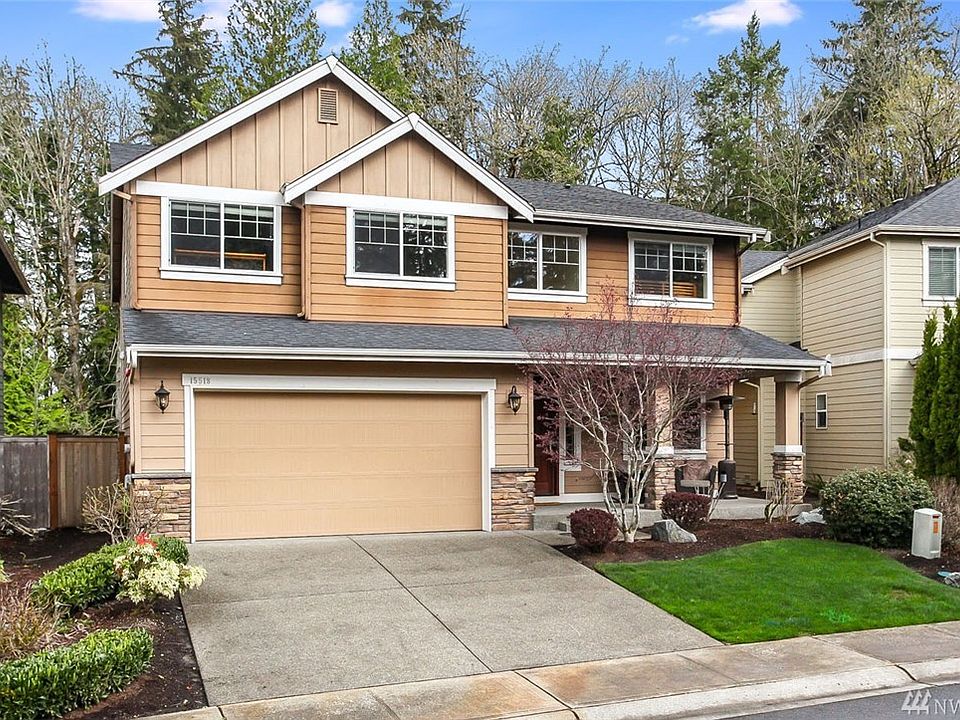 Welcome home to WoodGrove. Prepare to be impressed as you walk into this gorgeous home and take in its luxury finishes and grand spaces. The stunning two story entry and staircase are just the beginning. Immaculate and open, this home is perfect for entertaining with an expansive kitchen featuring granite and stainless finishes, double ovens, 5-burner gas range and a butler's pantry leading to the elegant formal dining area. Stay connected with guests in the open family room and informal dining area or extend your entertaining outside to the amazing covered deck with skylights, radiant heat & gas plumbed firepit. This home showcases the best in Northwest living and enjoys permanent greenbelts in the front and back of the home. Enjoy 5 bedrooms plus a bonus area. Let your cares slip away in the luxurious master suite with gorgeous ensuite bath. The main floor also has a bedroom and adjacent bath with walk-in shower! Welcome home!