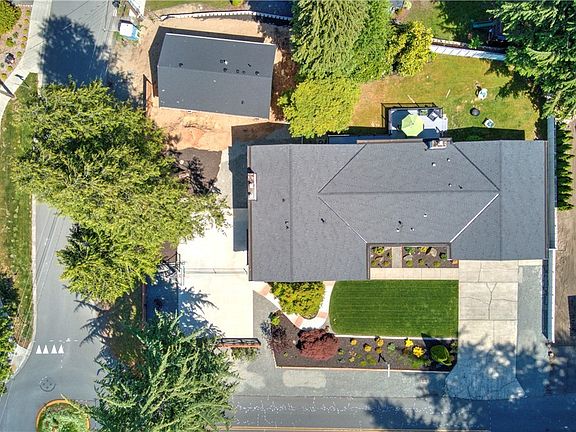 Spacious lot with a large backyard and a sports court. 
