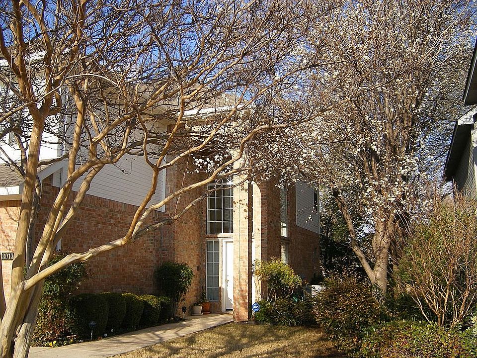 Front with Matured Trees & front entry garage