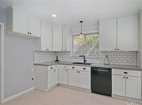 Kitchen: Pantry to the right next to door leading to deck. New Bosch dishwasher.