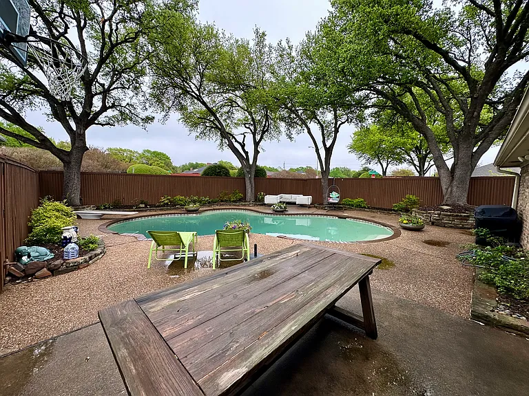 View of pool with a patio, a diving board, a fenced in pool, and a fenced backyard