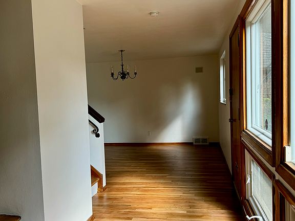 From front door past great room toward dining area