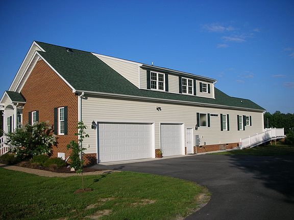 3 car garage, paved d/w