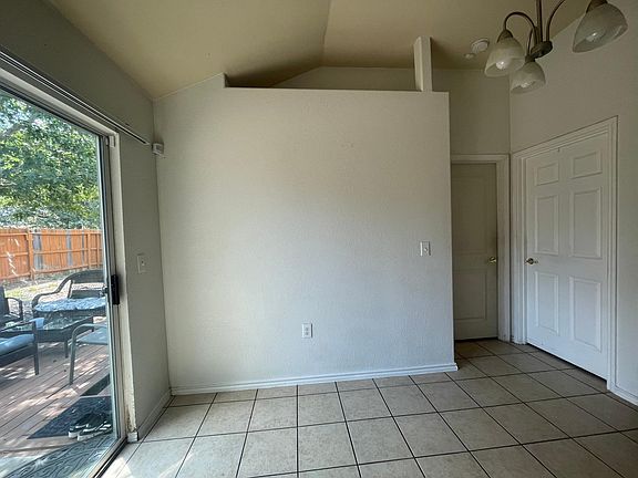 Dining area leading to master and laundry closet. Sliding door to backyard.