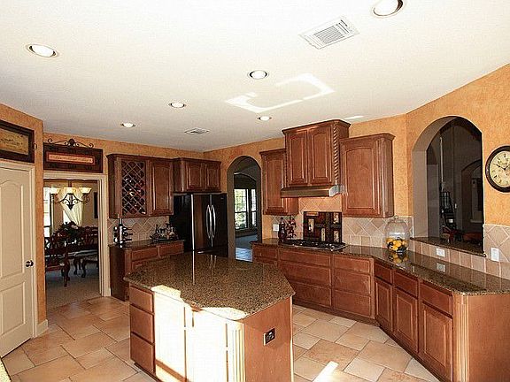 Kitchen features granite counters, HUGE island, Stainless Steel Appliances