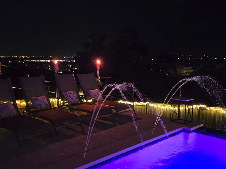 The pool doesn't close at sunset. Neither does the view.