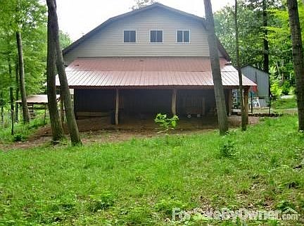 Barn/shed area in back of 2 story garage
						:
						Barn/shed space for goats, horses or other animals or extra storage-your choice!