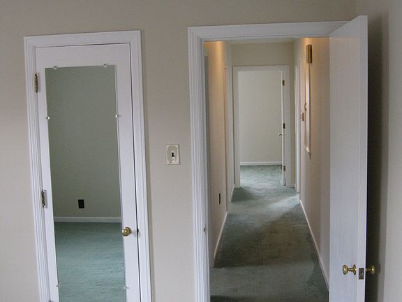 View from back bedroom via hallway to front bedroom.