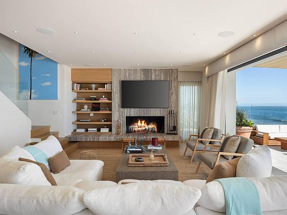 Sink into the spacious sofa facing a large Smart TV.