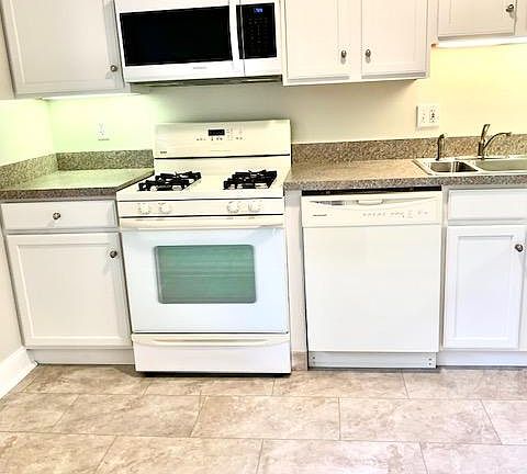 kitchen-new countertops and floor. Updated cabinets, new microwave.