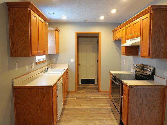 Kitchen, Laundry, and Exit to Garage