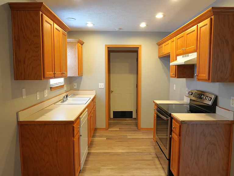 Kitchen, Laundry, and Exit to Garage