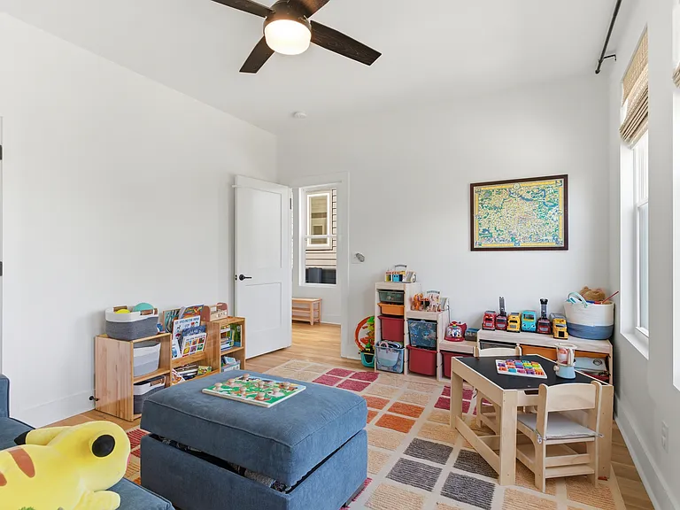 Main-floor bedroom with flexible use as a home office, bonus room, or playroom.