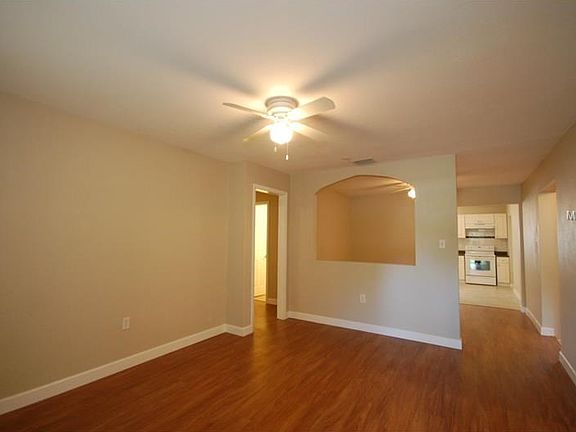 Living room looking into dining room and kitchen