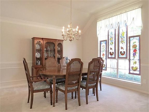 Formal dining room is large! And the floor-to-ceiling window adds just the right touch of elegance!