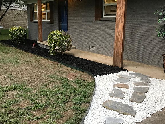 Fresh landscaping and rock walkway
