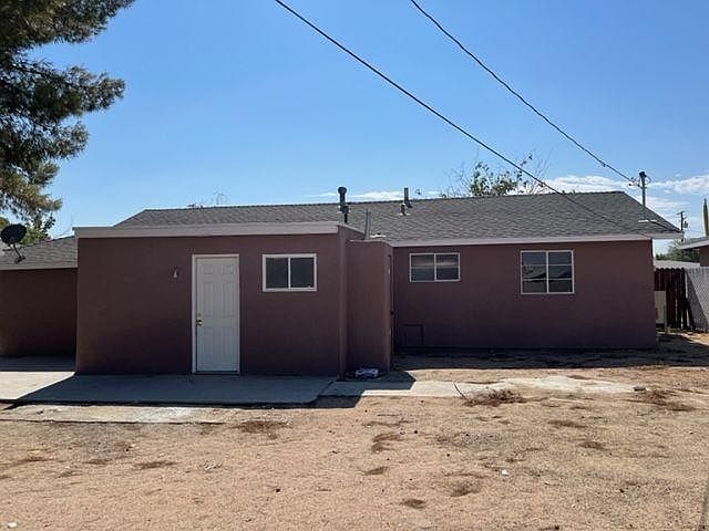 Backyard with storage unit on side