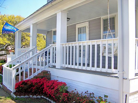 Front of house. Wrap around deck on other side.