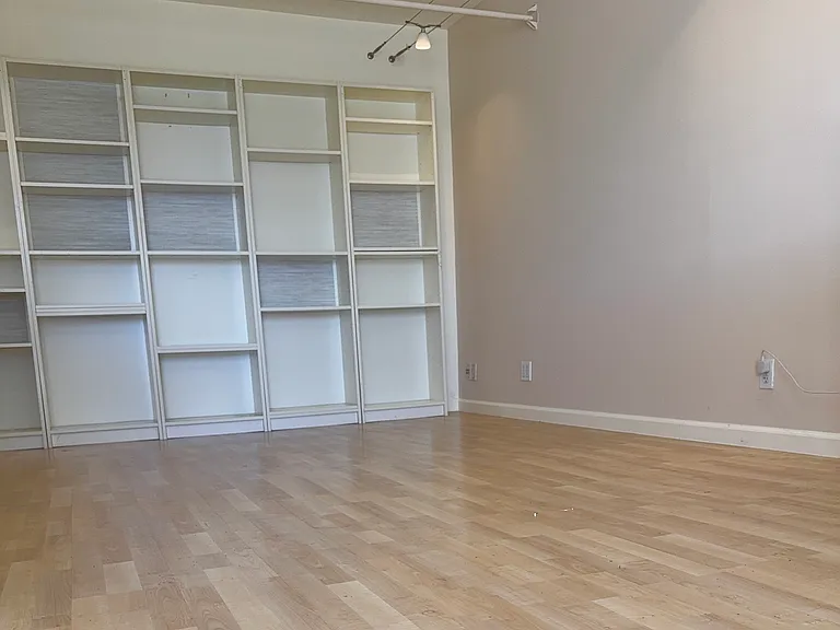 ...as well as ample built in storage space on the east wall.