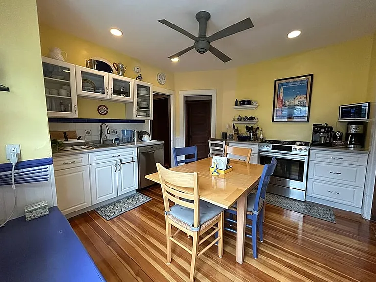 Charming eat-in kitchen with huge pantry makes cooking, baking, and eating a joy!