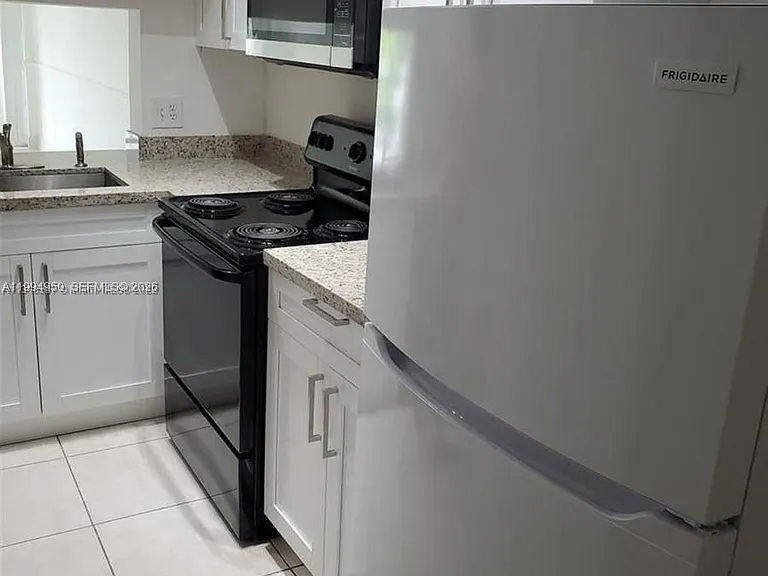 7435 Woodmont Ter #202 — Photo 11
