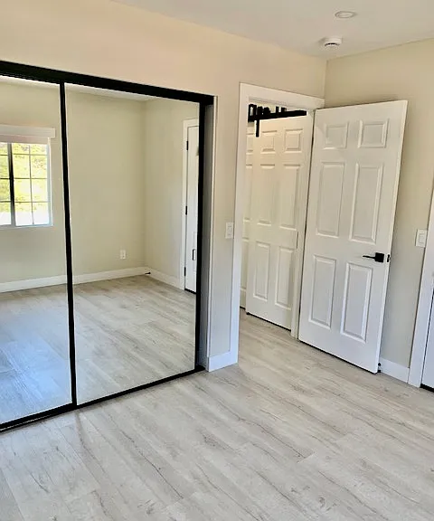 bedroom closet with sliding mirrored doors