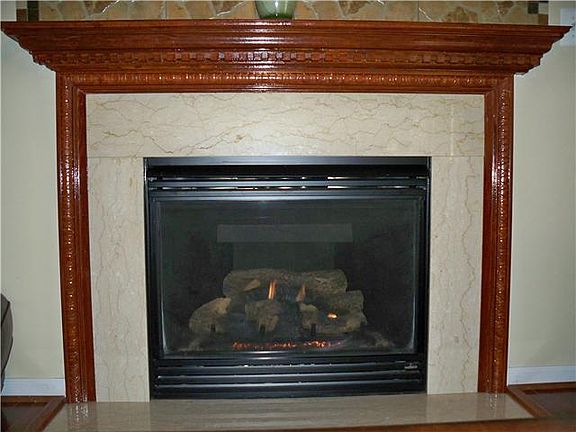 Custom Marble & Mahogany Gas Fireplace