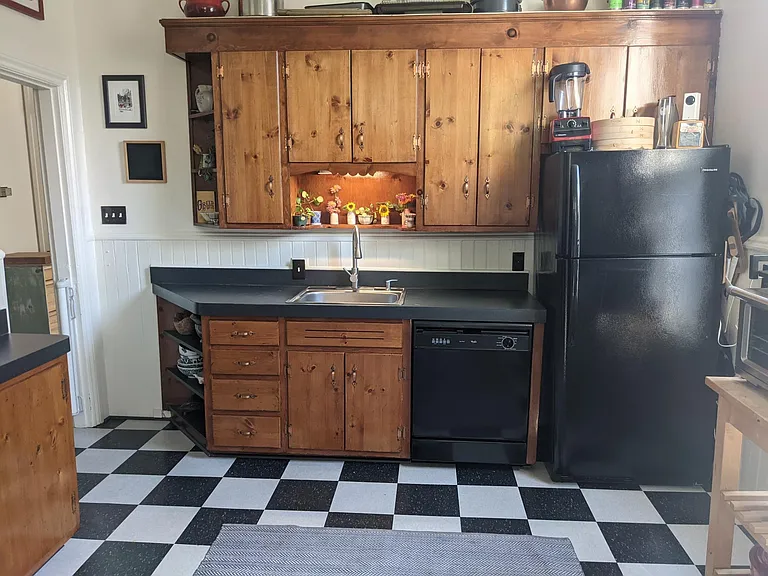 Charming kitchen with adjacent pantry and laundry.