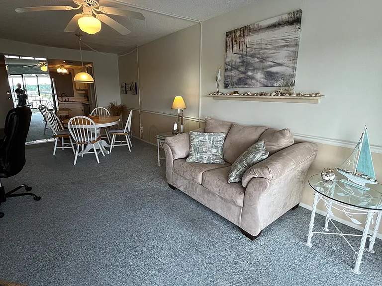 Looking toward dining area and the kitchen at far right.