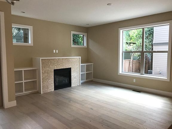 Great Room--fireplace, built-ins and hardwood floors